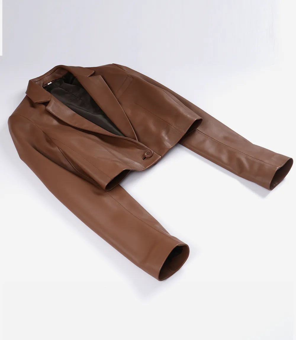 Maren women's brown cropped leather blazer laid flat, showing notch lapels and single-button front