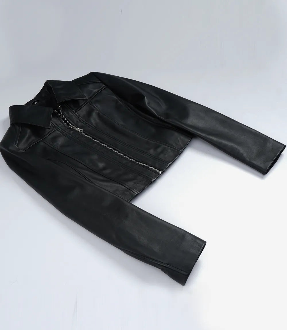 Cora women's black cropped zip-up leather jacket laid flat, showing pointed collar and long sleeves
