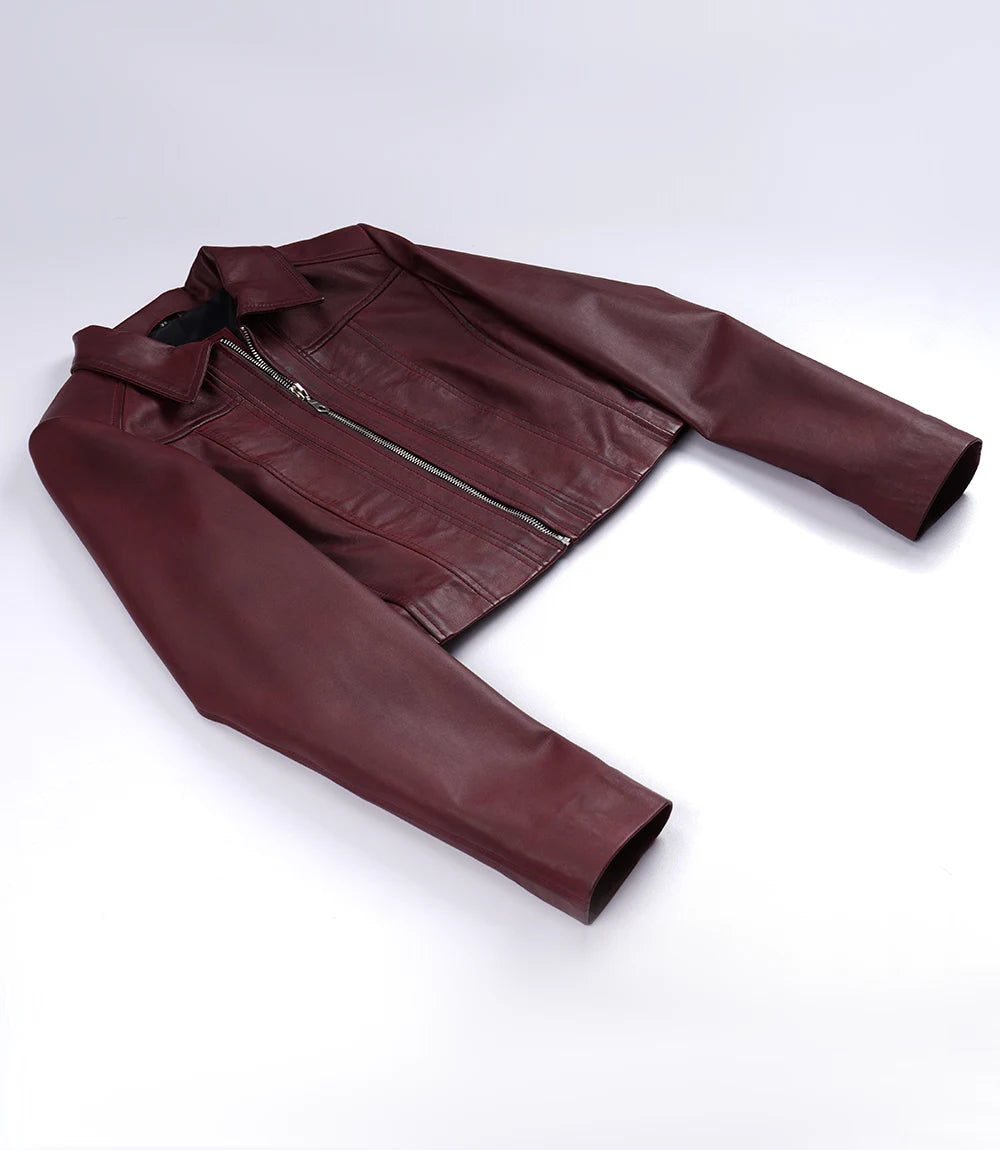 Cora women's burgundy cropped zip-up leather jacket laid flat, showing long sleeves and cropped hem