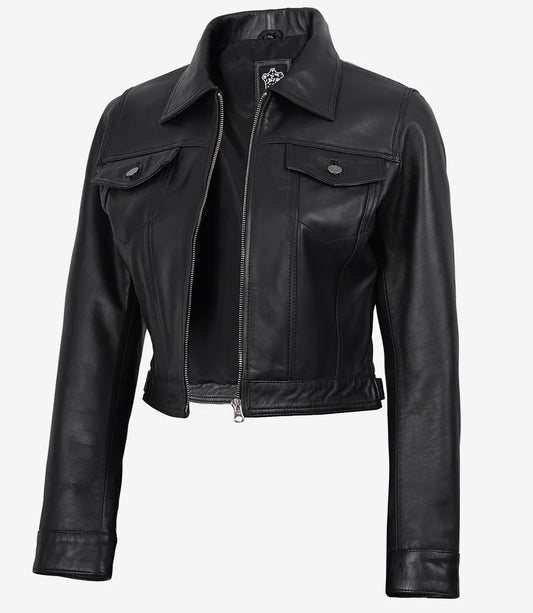 Angled front view of Elara women's black cropped leather trucker jacket with a front zip and flap chest pockets