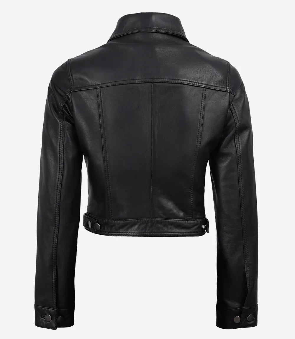 Back view of Elara women's black cropped leather trucker jacket showing panel seams and adjustable waist tabs