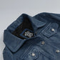Women's blue washed leather trucker jacket, full front view
