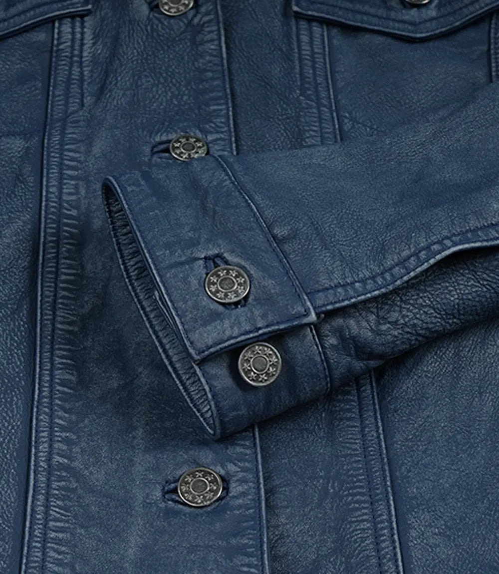 Women's blue leather trucker jacket, front view close-up