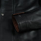 Men's black leather jacket features, pocket and cuff detail