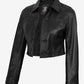 Angled front view of Mila women's black cropped leather trucker jacket showing the button fastening and cropped hem