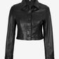 Buttoned front view of Mila women's black cropped leather trucker jacket with two chest patch pockets