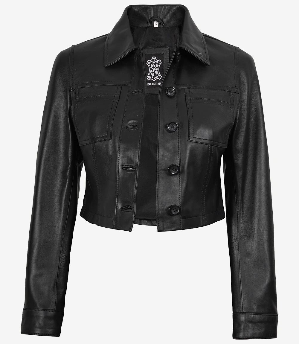 Front view of Mila women's black cropped leather trucker jacket worn open with a pointed collar and chest pockets
