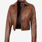 Angled open front view of Mila women's brown cropped leather trucker jacket with chest patch pockets