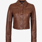 Buttoned front view of Mila women's brown cropped leather trucker jacket with a pointed collar