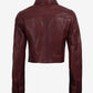Back of Mila women's burgundy cropped leather trucker jacket showing shoulder yoke and button cuffs
