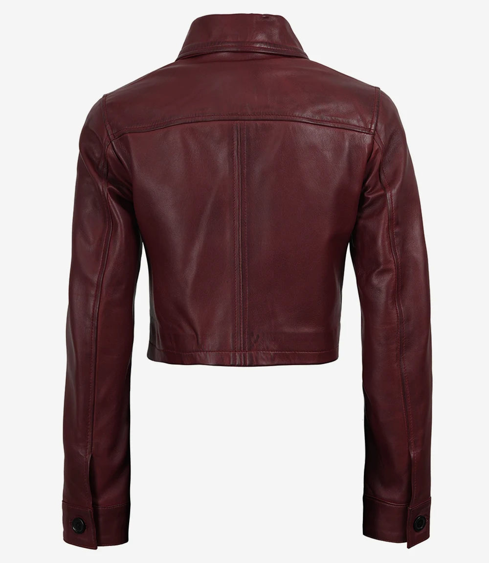 Back of Mila women's burgundy cropped leather trucker jacket showing shoulder yoke and button cuffs
