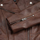 Close-up of the zipped sleeve cuff on Rhea women's brown leather biker jacket
