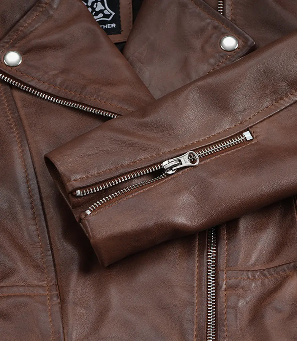 Close-up of the zipped sleeve cuff on Rhea women's brown leather biker jacket