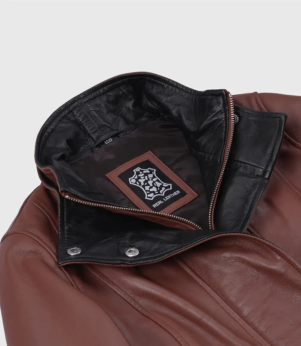 Close-up of Rowan jacket's black contrast collar, snap fasteners and front zip