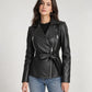 Woman wearing the Vesper black belted leather biker jacket with jeans